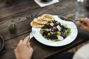 A woman eating a salad