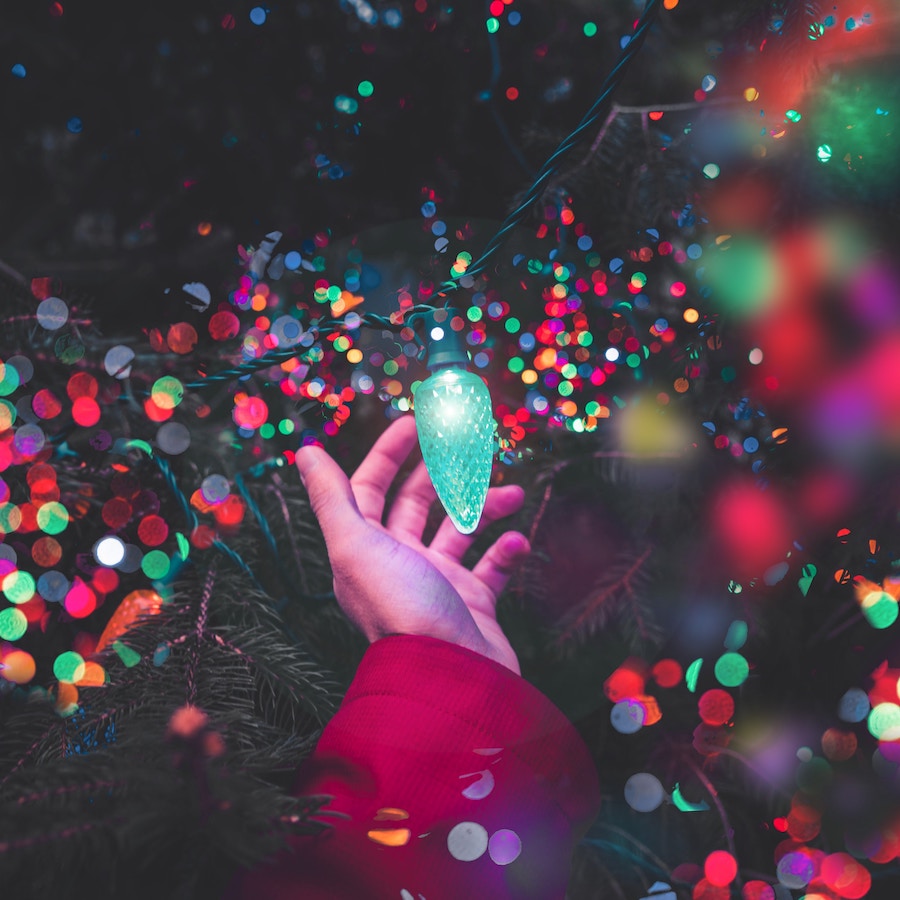 Person touching Holiday light displays