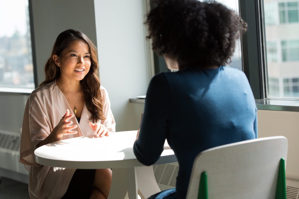 Women talking at a table